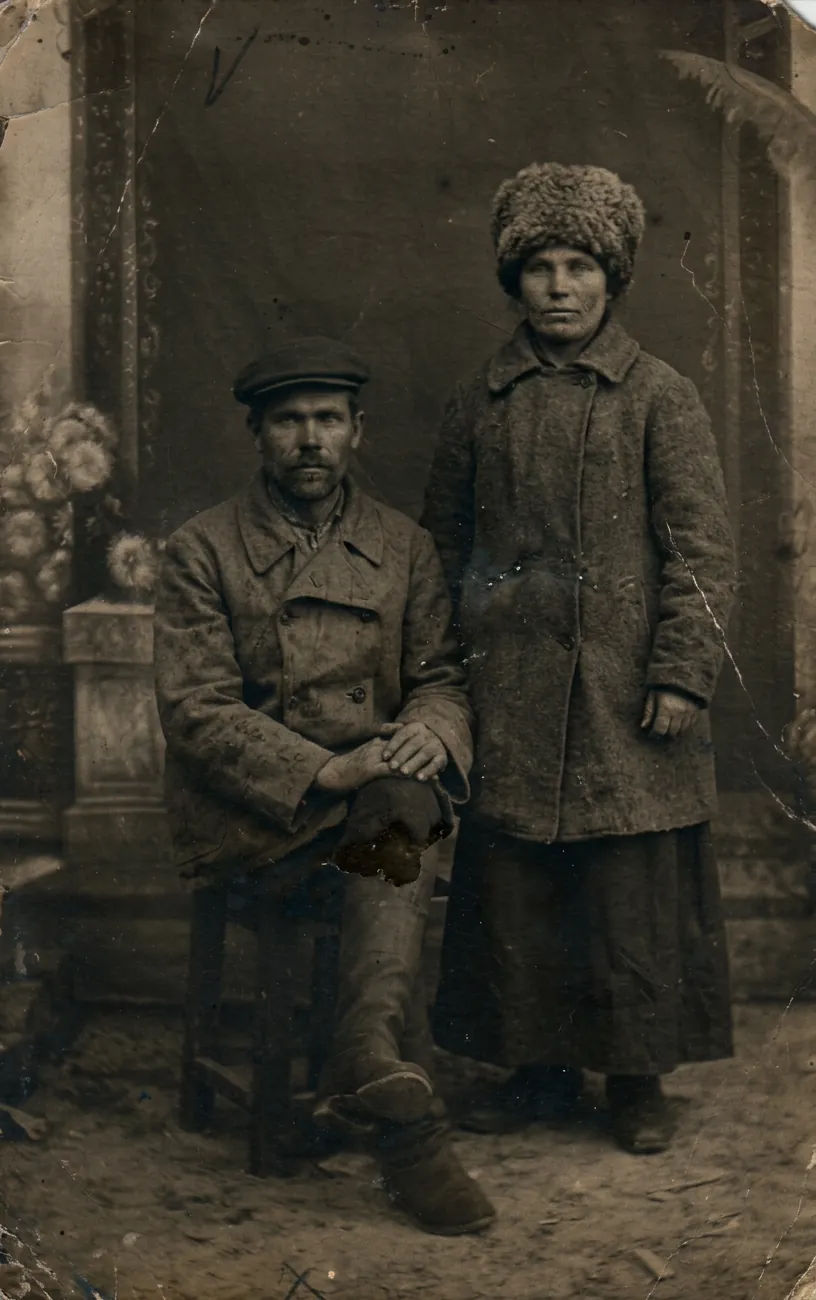 A couple in winter coats, photographed in black and white - the same picture in natural color